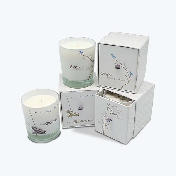 Elegant candle boxes with drawer-style design, featuring custom printed graphics and premium packaging for candles.