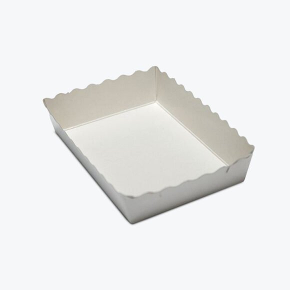 White scalloped edge cardboard food tray, designed for serving baked goods and meals in a stylish and secure way.