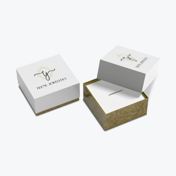 Custom jewelry boxes with logo, featuring a white and gold elegant design for Trend Jewellers.