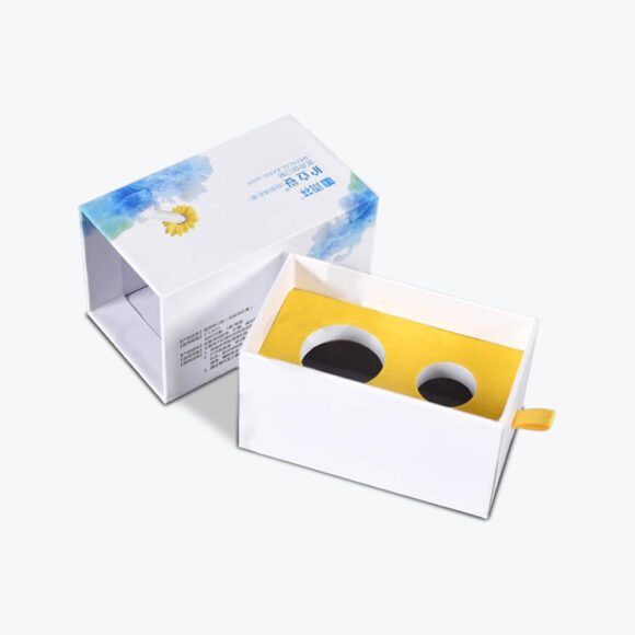 Custom pill packaging with a white printed tablet box and yellow insert.