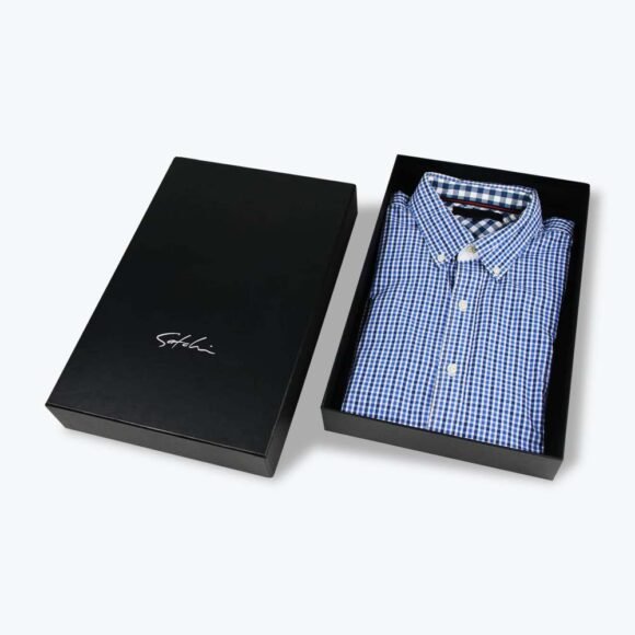 Custom printed shirt box with logo, featuring a sleek black design and a neatly folded blue checkered shirt inside, showcasing premium packaging.