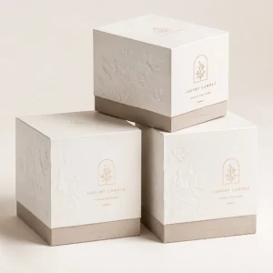 Premium cardboard candle boxes with embossed floral design, custom printing, and luxury finish