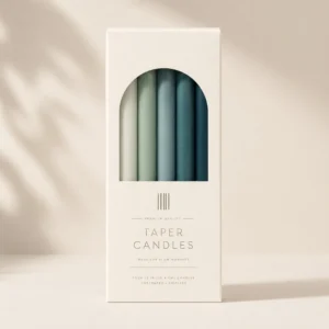 Taper candle packaging with window cutout, printed cardboard box design, and premium candle presentation
