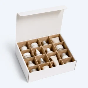 Cardboard partition inserts in a white box organizing cosmetic bottles, jars, and tubes with protective separators
