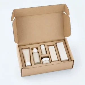 Corrugated box inserts inside a kraft mailer box organizing cosmetic tubes, bottles, jars, and product cartons