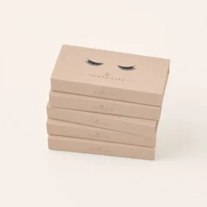Eyelash packaging boxes stacked in neutral beige retail design